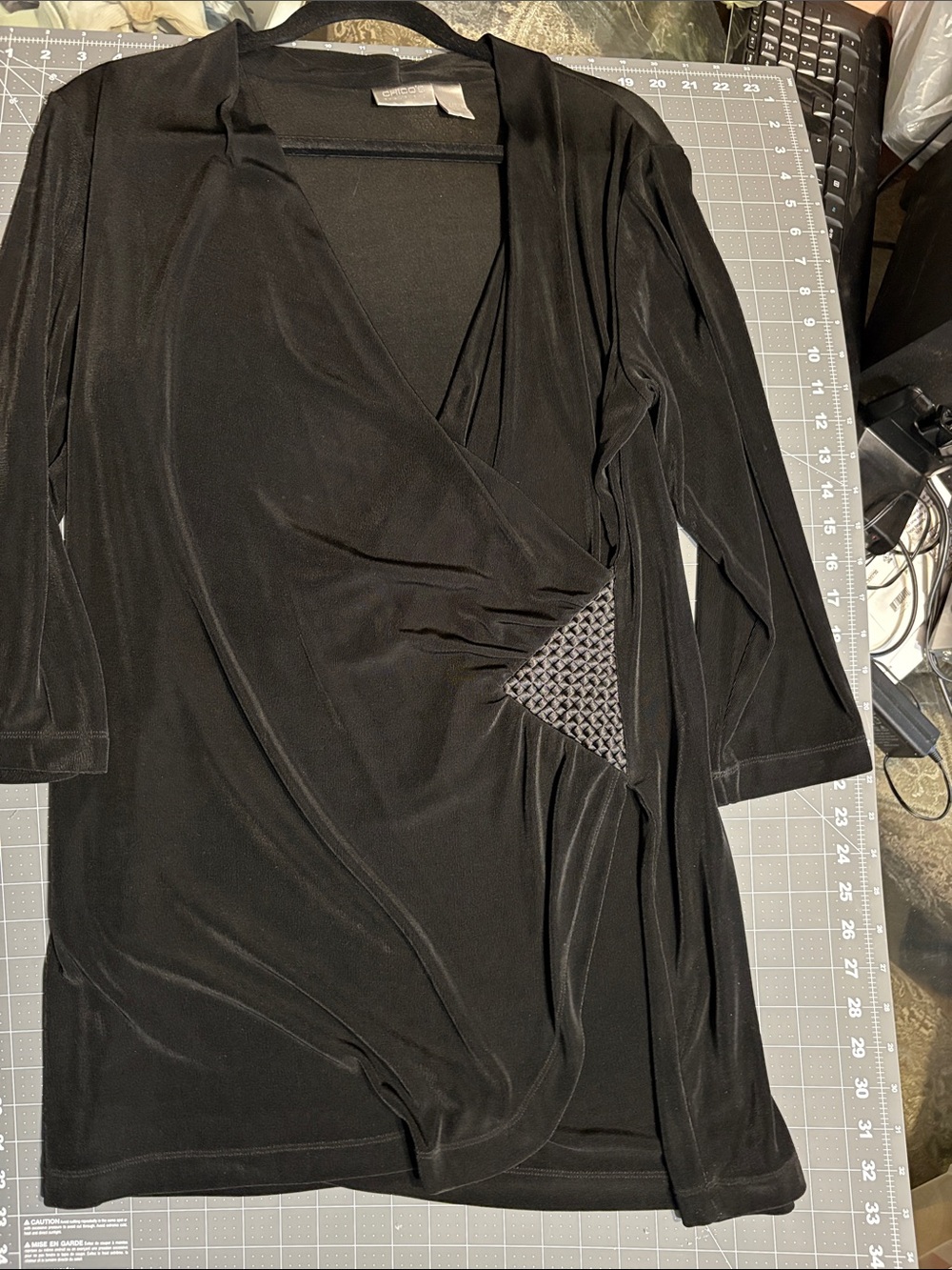 Chico’s Travelers Black Faux-Wrap Top with Textured Side Panel and Slit